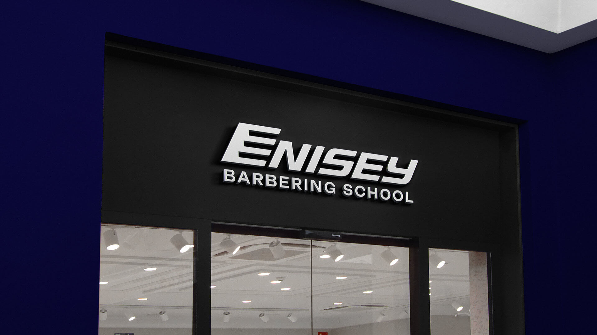 Разработка логотипа и фирменного стиля для школы барберов ENISEY BARBERING SCHOOL в Красноярске — дизайн фасадной вывески и визуальная айдентика образовательного бренда.